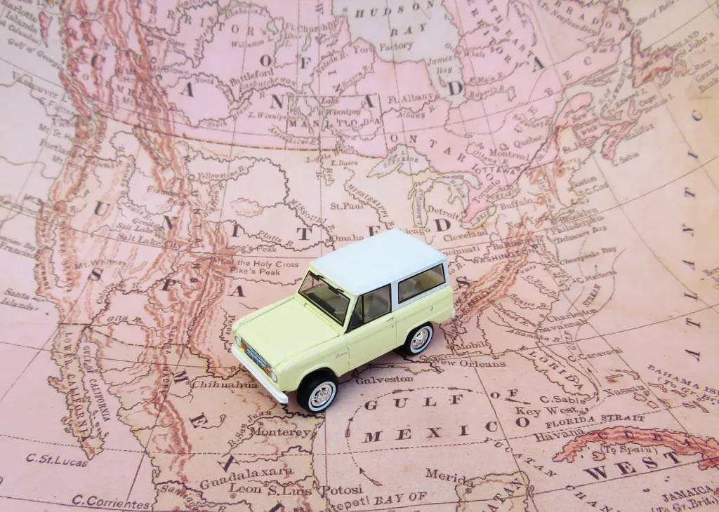 a toy car on a map of the united states
